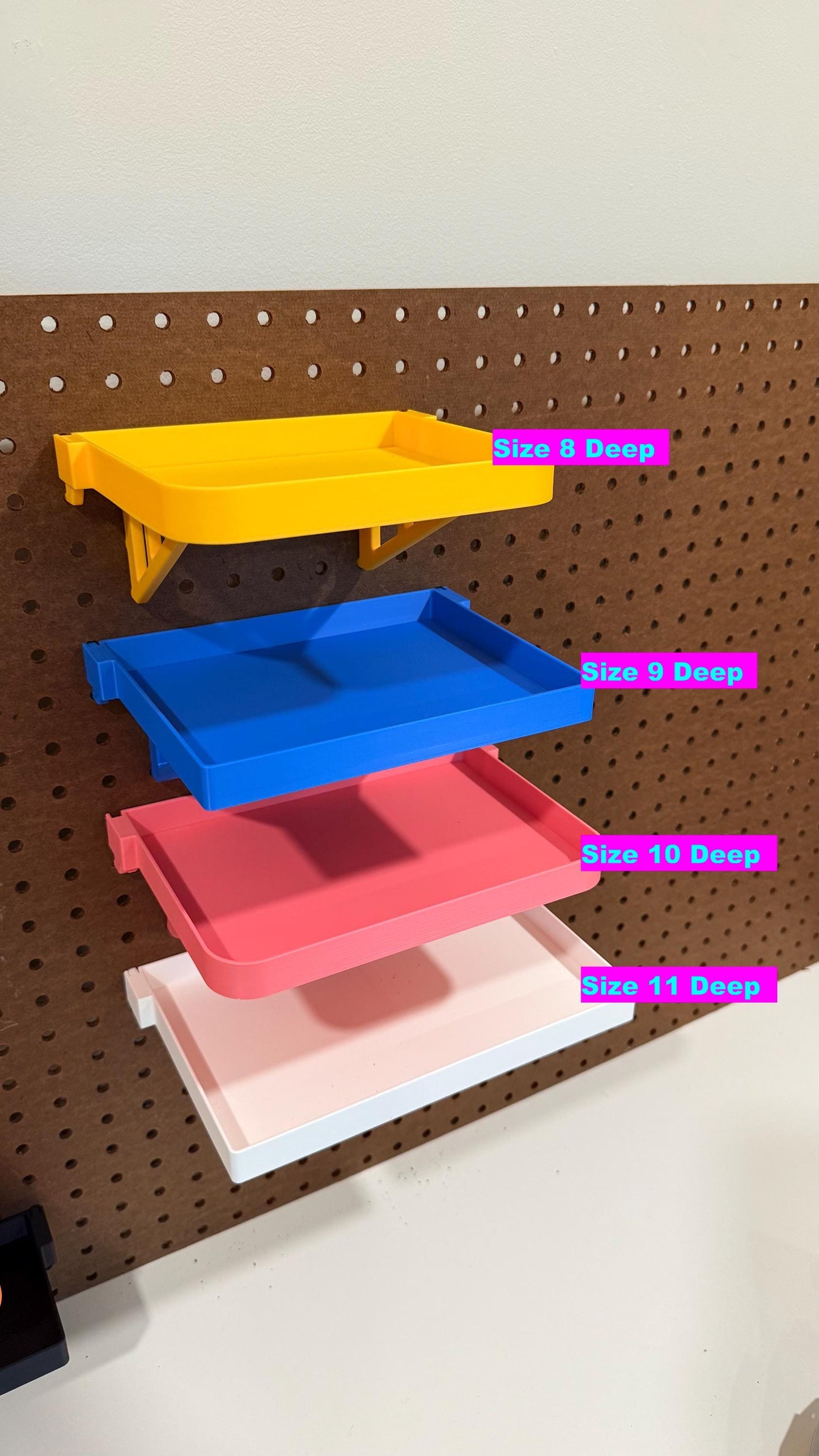 Standard and reinforced deep pegboard shelves on display