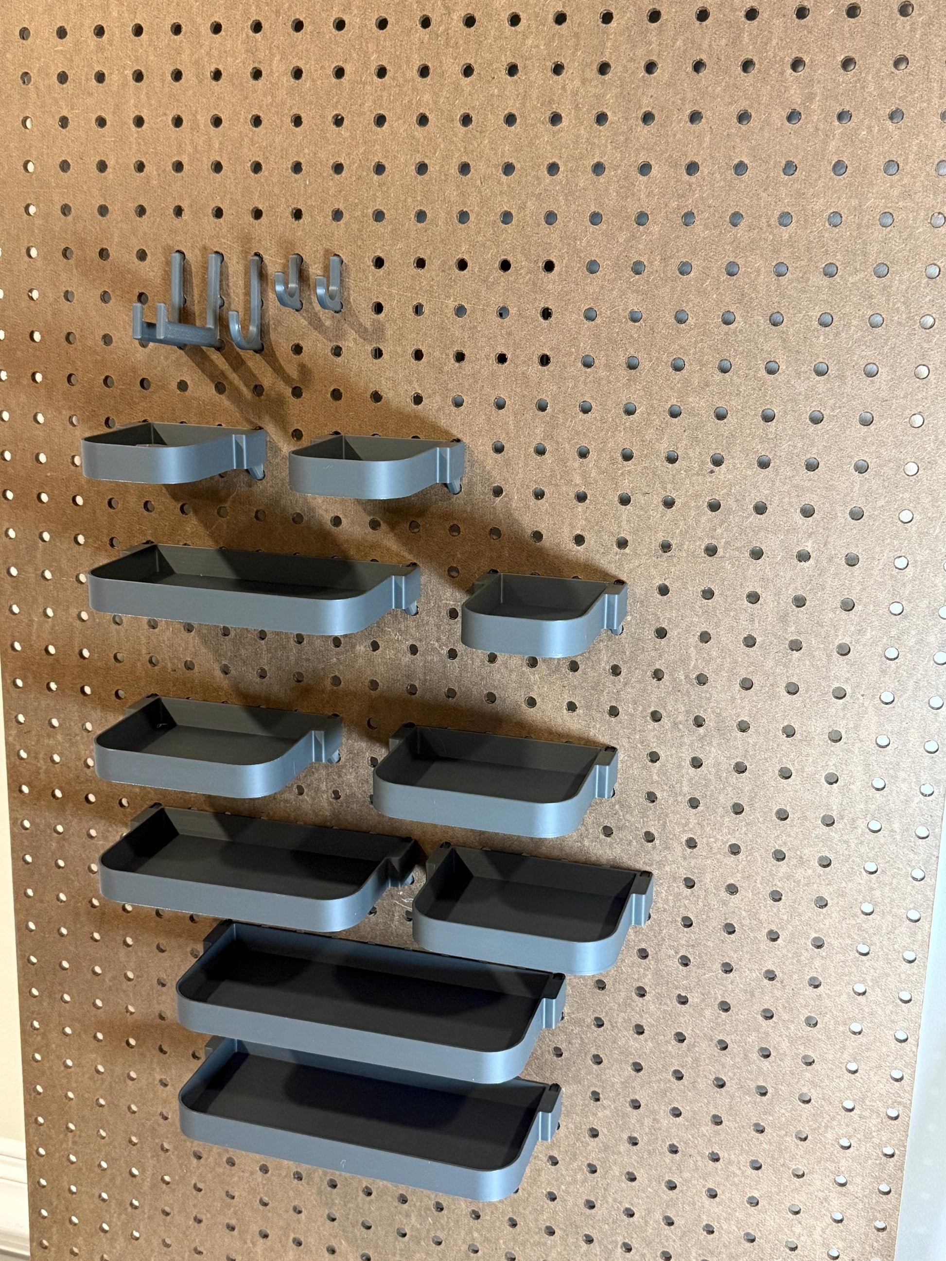 Pegboard kit for standard 1/4 inch boards — hooks and shelves installed