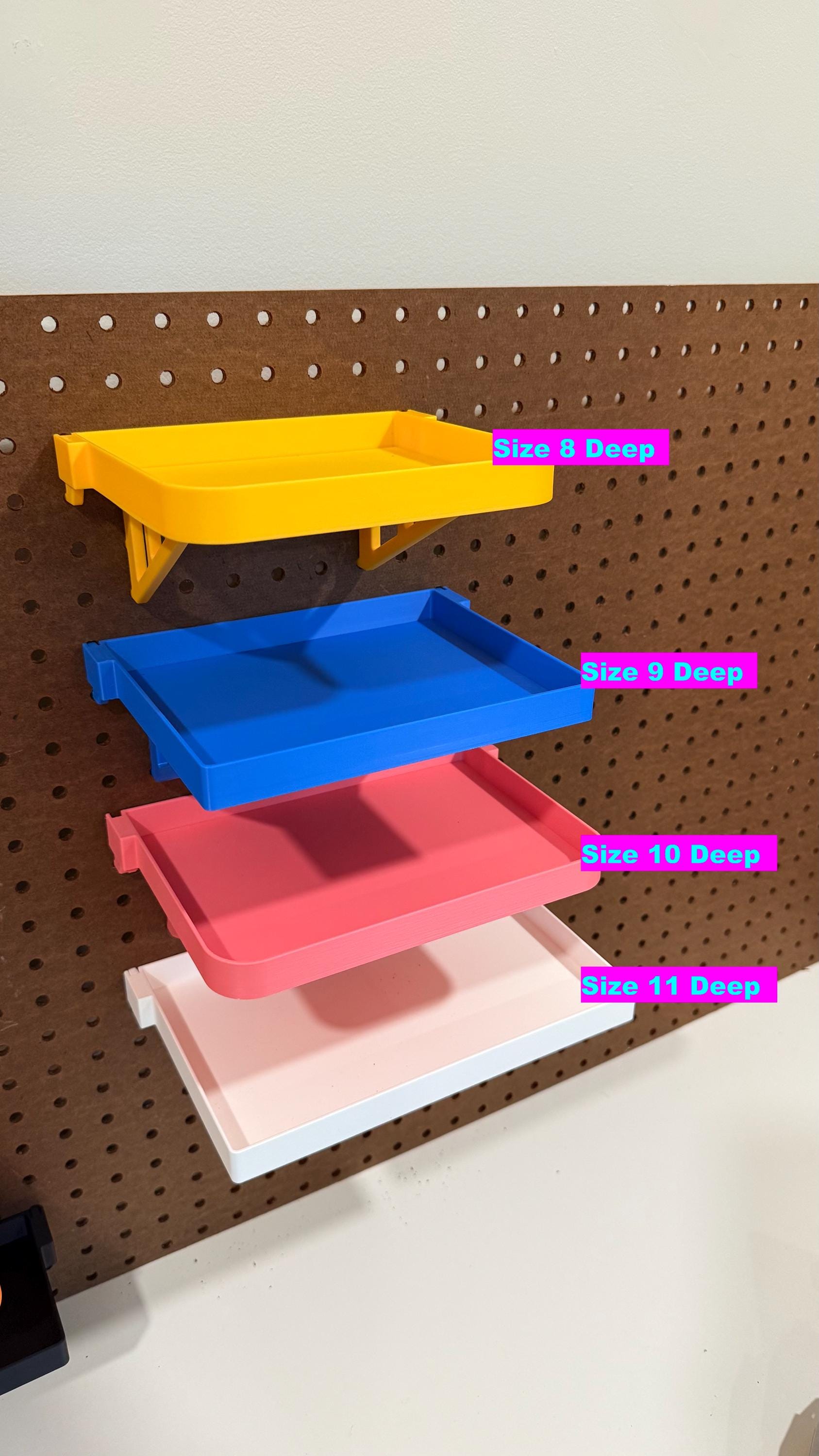 Standard and reinforced deep pegboard shelves on display