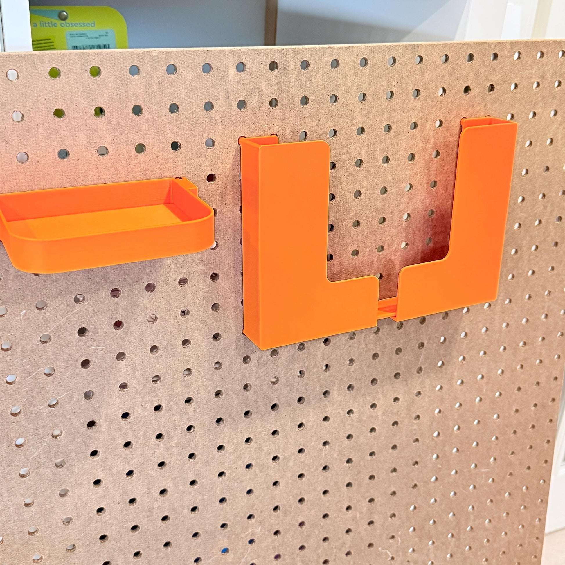 Adjustable Pegboard Paper Holder