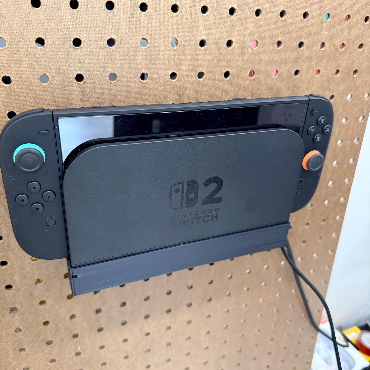 Switch® 2 Dock Holder Shelf for 1/4” Pegboard – Wall Mount & Gaming Organizer